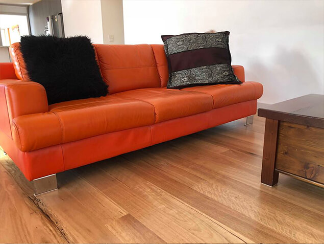 Blackbutt Flooring 130x14mm with red sofa